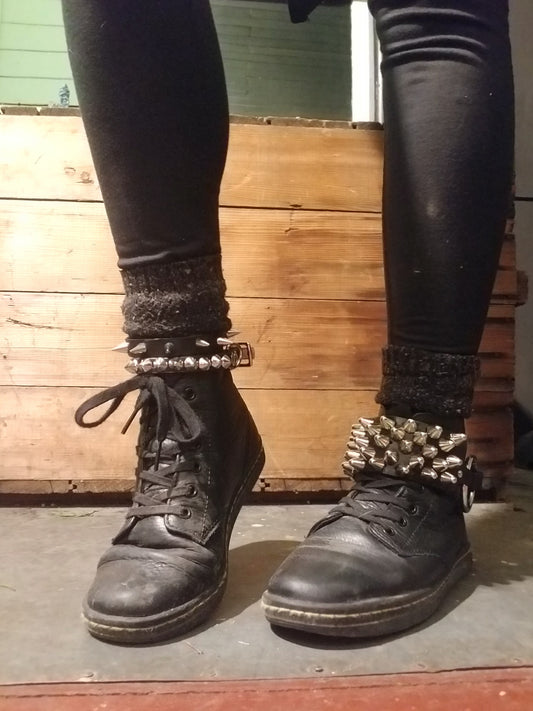 77 tall cone stud single row strap